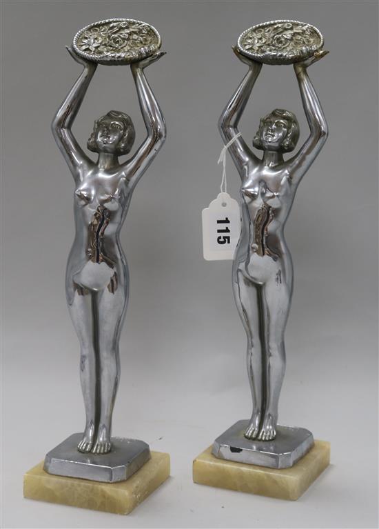 A pair of Art chrome plated figures of ladies, signed Limousin